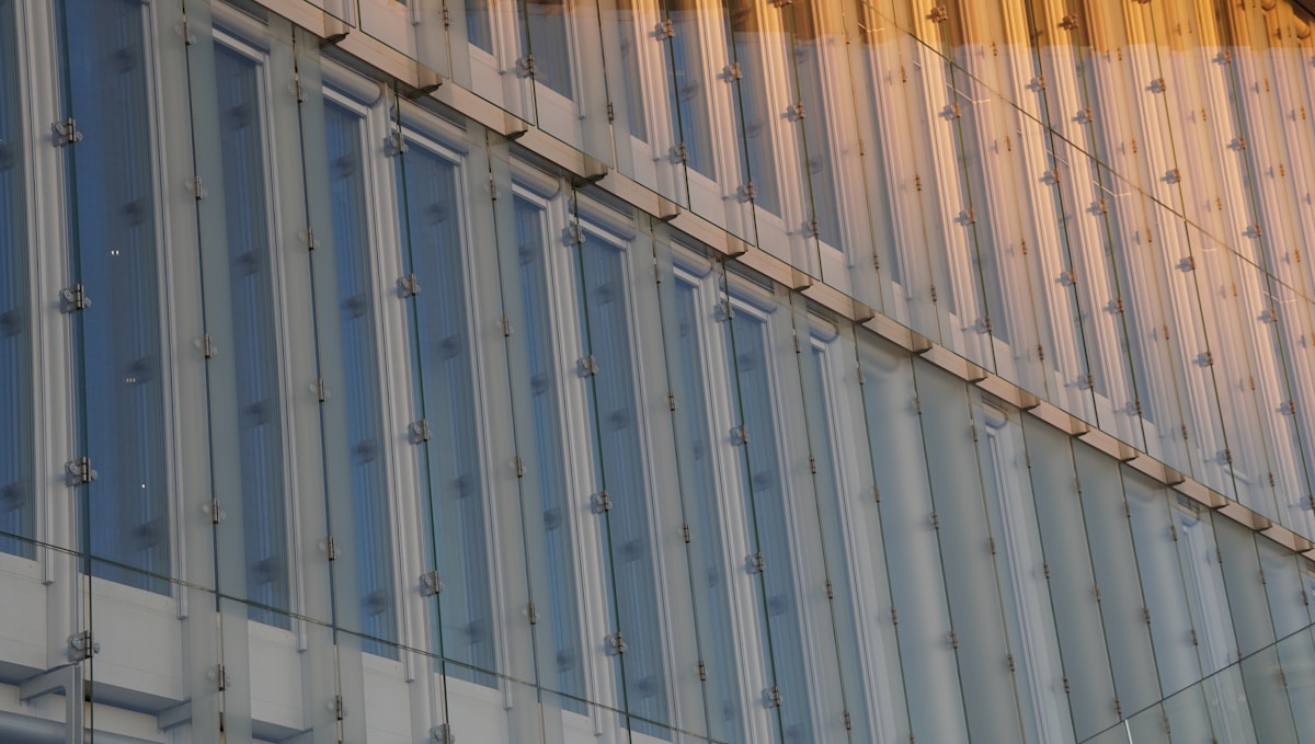 Modern building facade with repeating windows.