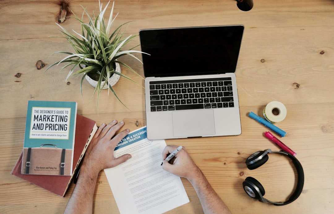 content marketing automation audit - A marketing professional sitting at a modern desk reviewing a content calendar on a larg
