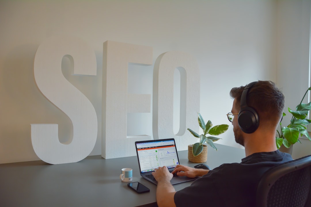 "Marketer reviews content calendar for consistency check, surrounded by analytics and planning tools on a tidy desk."