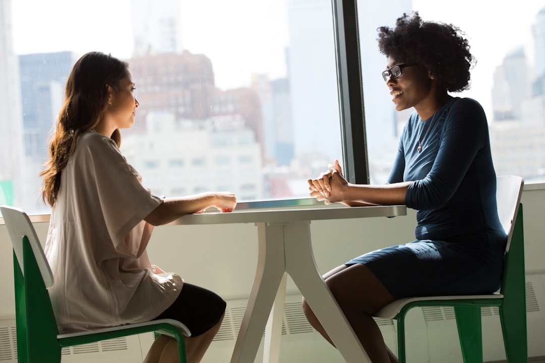 "Professionals reviewing SEO analytics and competitor gap analysis reports on printed charts and laptop in modern office."