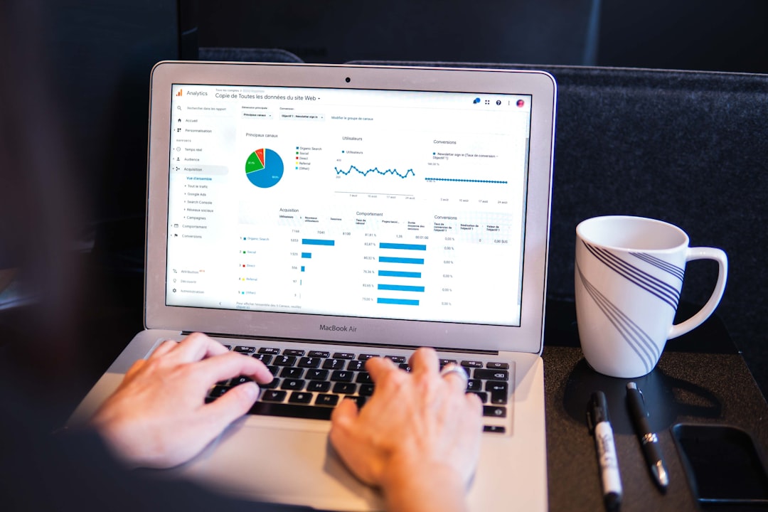Web developer reviews SEO dashboard on computer, graphs showing site performance and ranking – website seo health check.