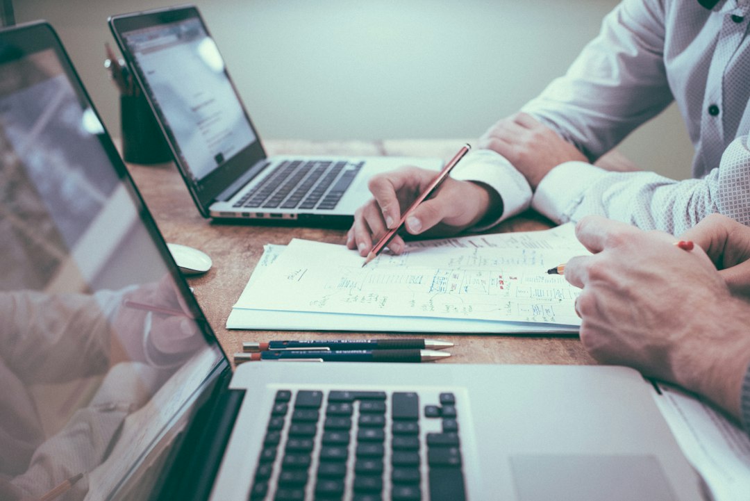 Business team reviewing SEO strategy on whiteboard, charts show search rankings and traffic growth – website seo health check
