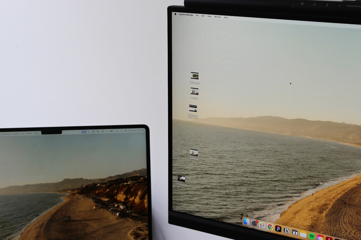 a laptop computer sitting on top of a desk