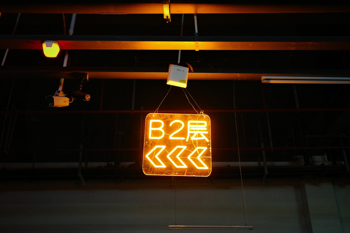 Glowing b2 sign hangs from a ceiling.
