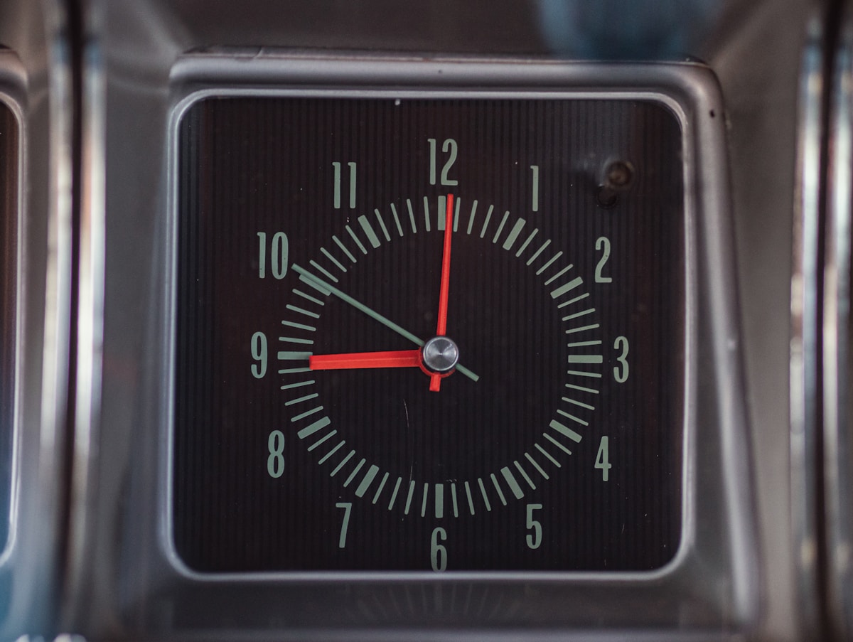 A close up of a clock on a table