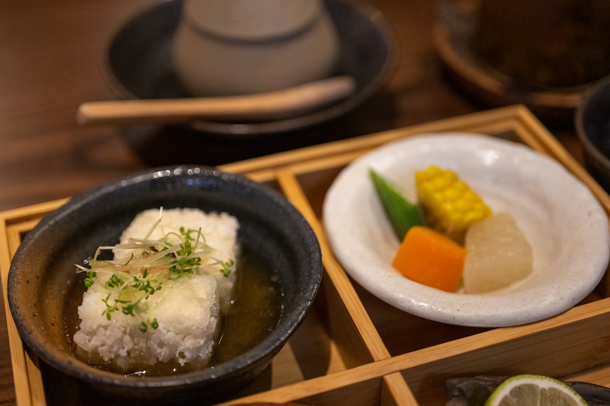 a bowl of soup next to a bowl of soup