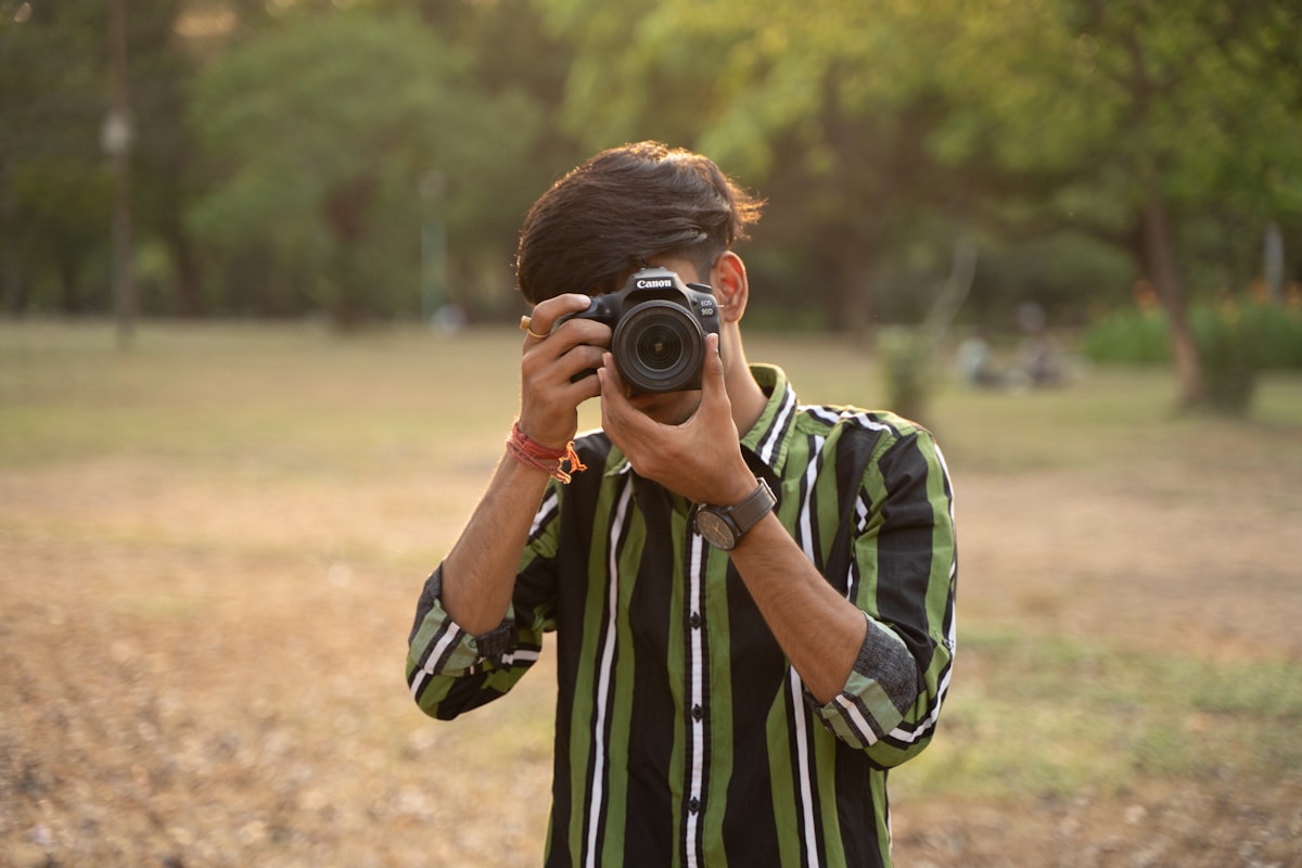 a man taking a picture of himself with a camera