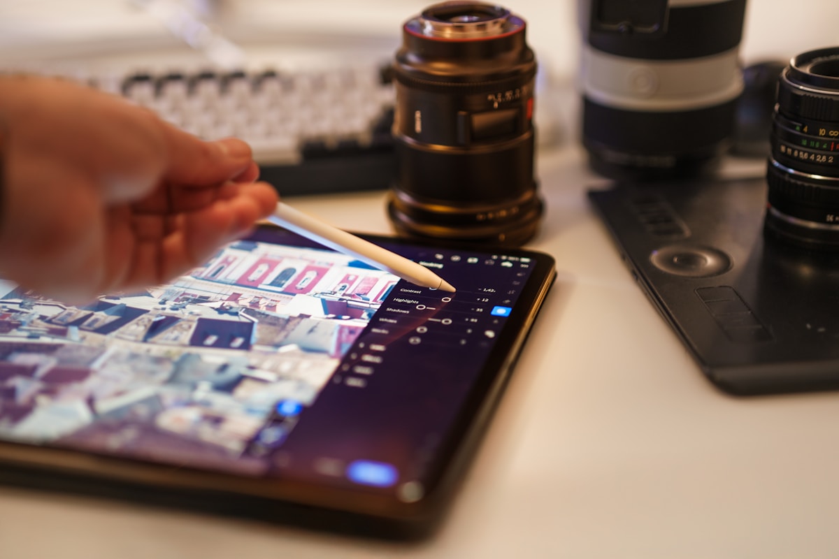 Someone is editing photos on a tablet.