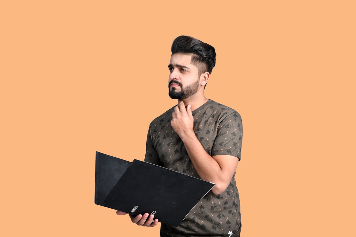 a man holding a laptop