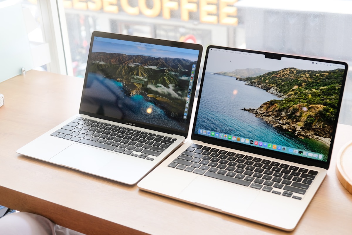 a couple of laptops on a table