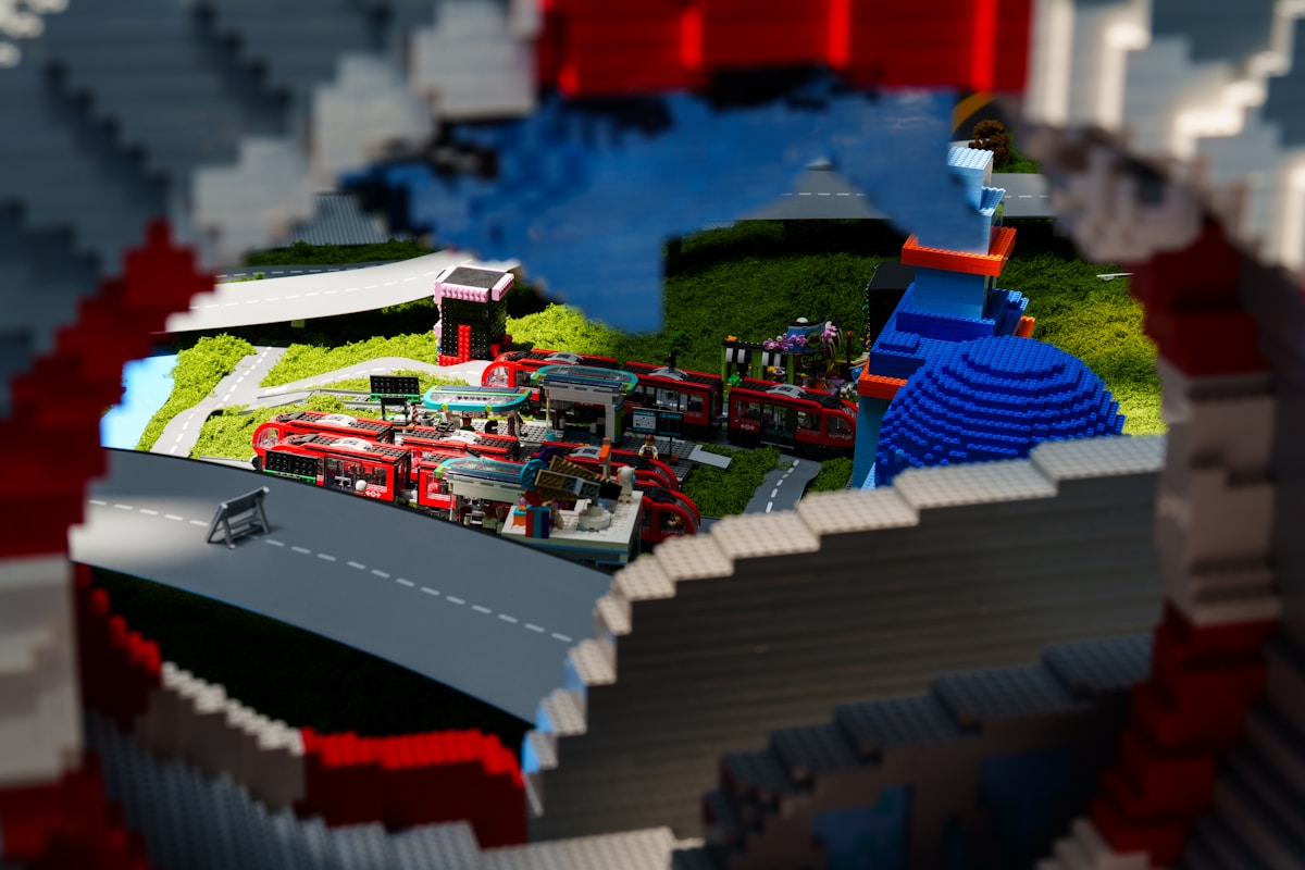 Lego city is seen through a lego archway.