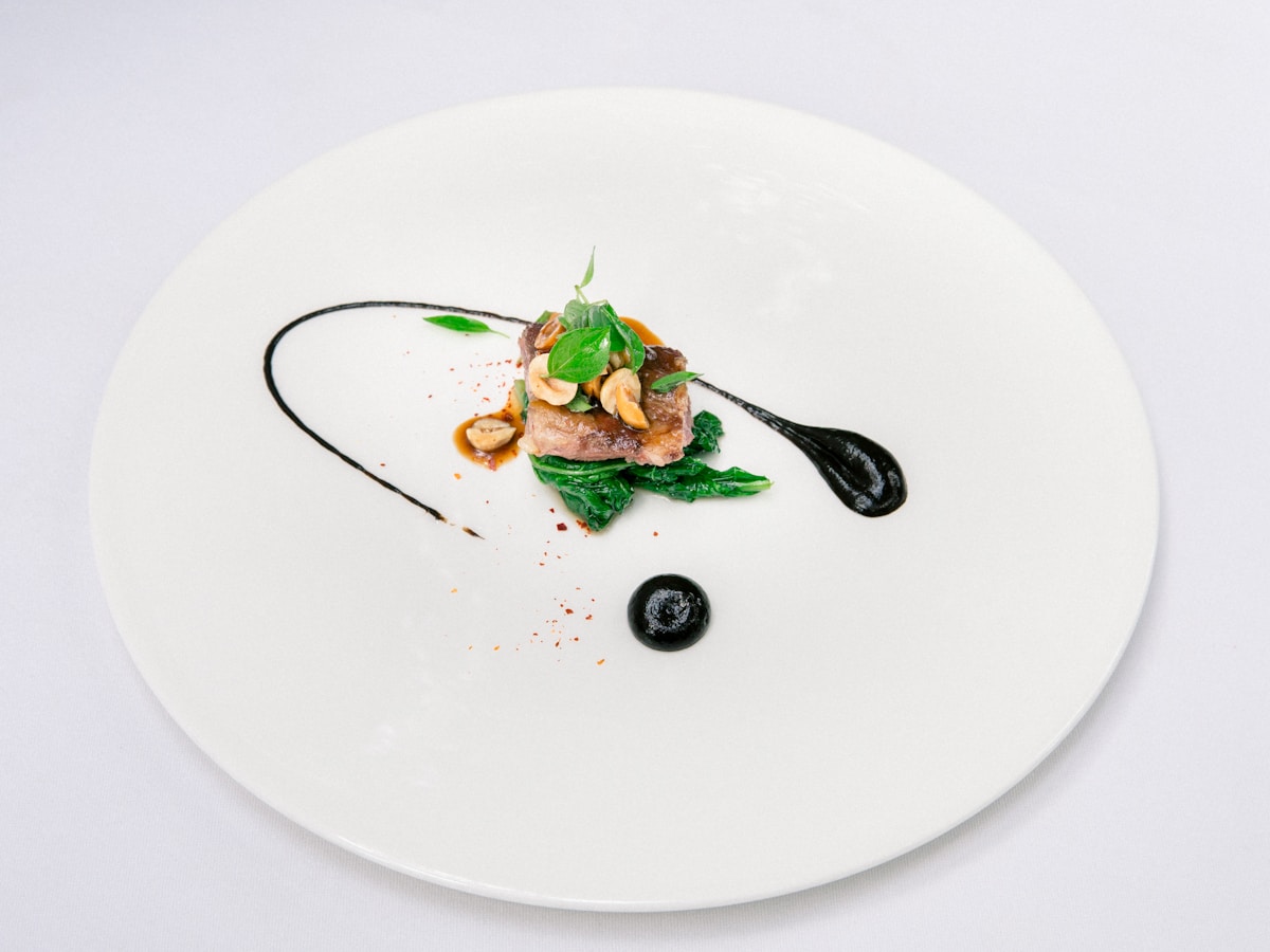 green vegetable on white ceramic plate