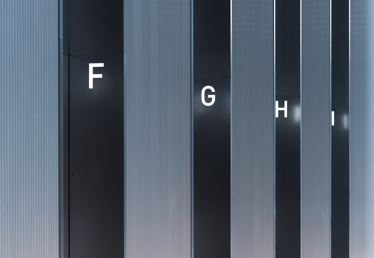 Abstract pattern of vertical lines and letters