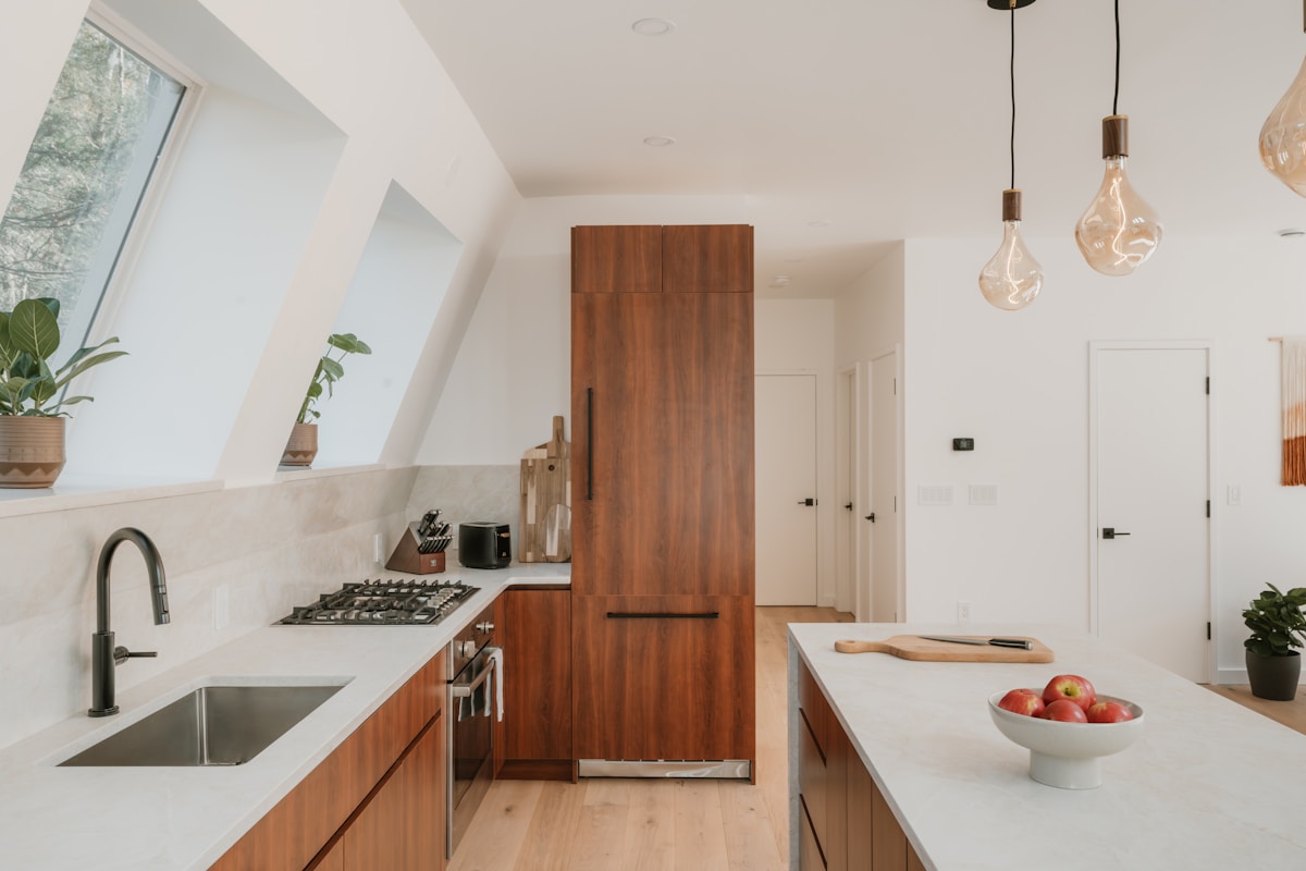Modern kitchen with wooden cabinets and island.