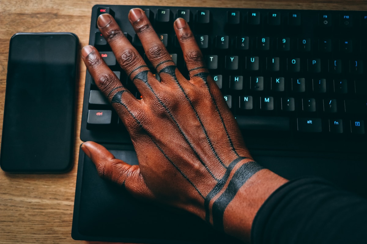 man with hand tattoo