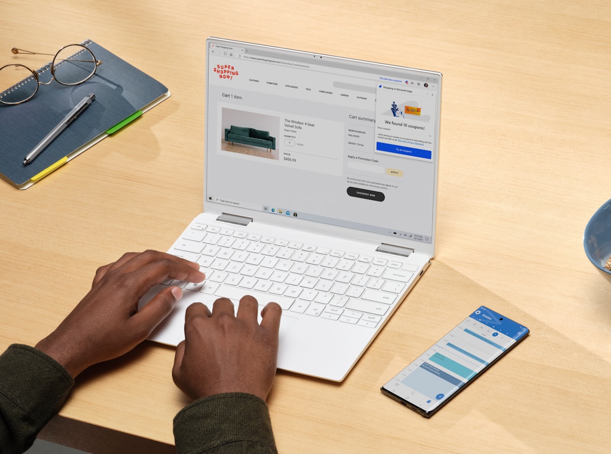 person using white laptop computer