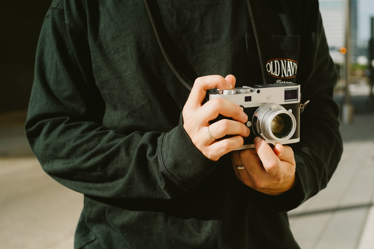A man holding a camera in his hands