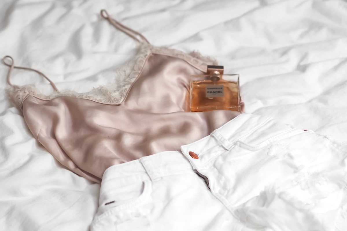 white brassiere on white textile