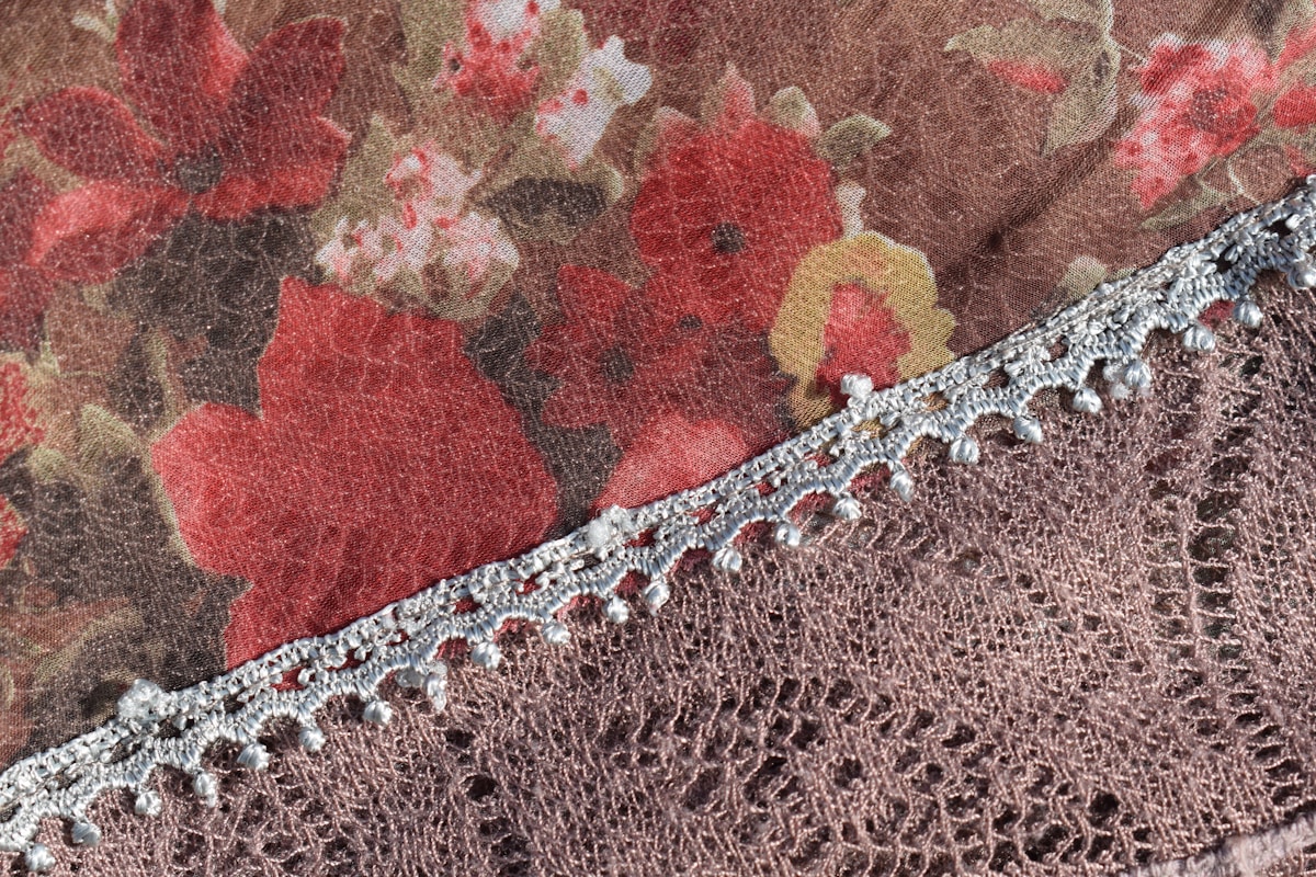Close-up of floral fabric with lace trim