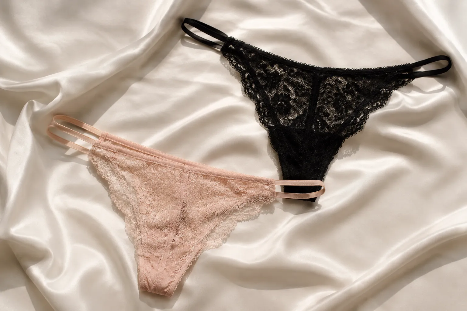 Delicate lace lingerie in black and pale pink.