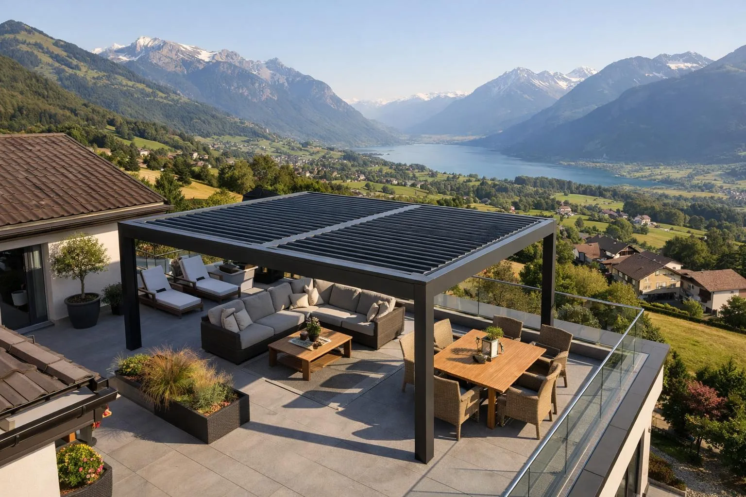 Terrasse avec mobilier de jardin et vue panoramique sur les montagnes.