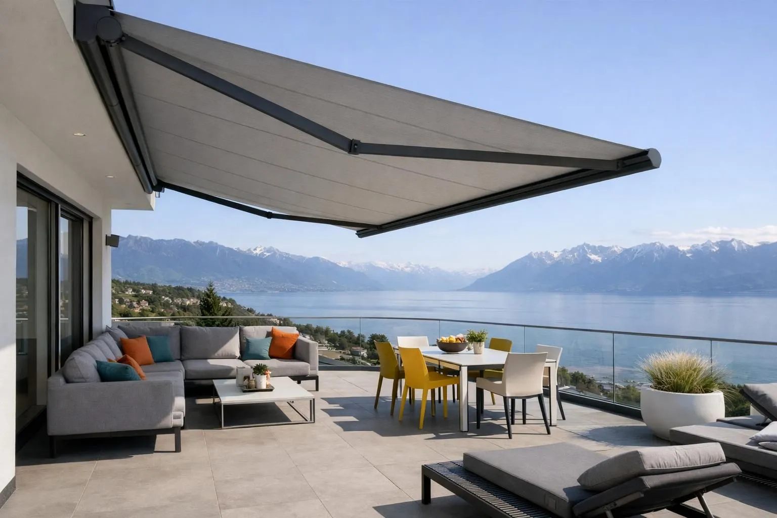 Modern motorized awning fully extended on a contemporary Swiss home terrace overlooking Lake Geneva, showcasing integrated cassette housing mechanism and quality fabric in neutral tones, sunlight filtering through, mountain peaks visible in background