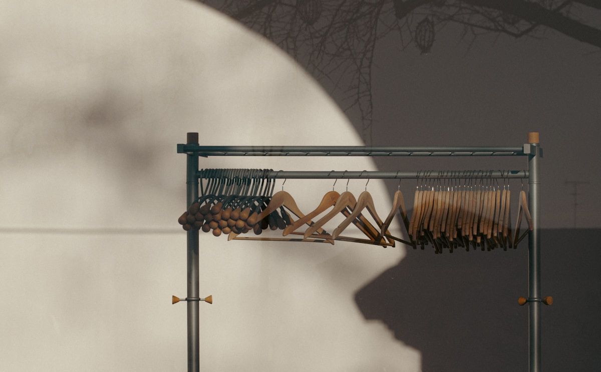 a rack with a bunch of clothes hanging on it