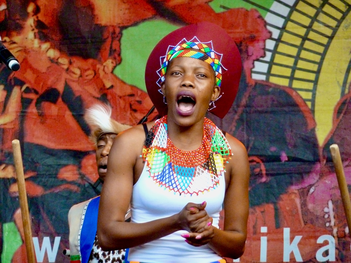 woman in white and red floral tank top