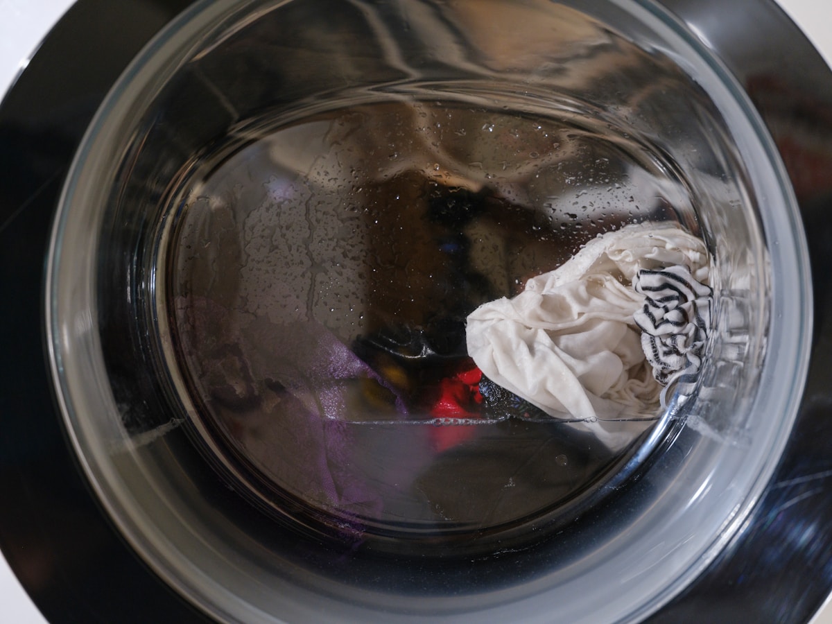 Washing machine drum with clothes and water