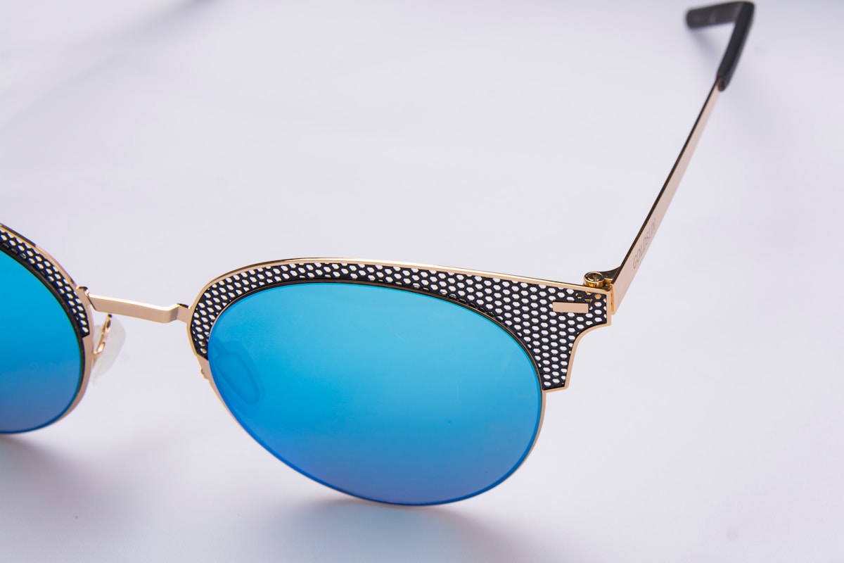 blue and gold framed aviator style sunglasses