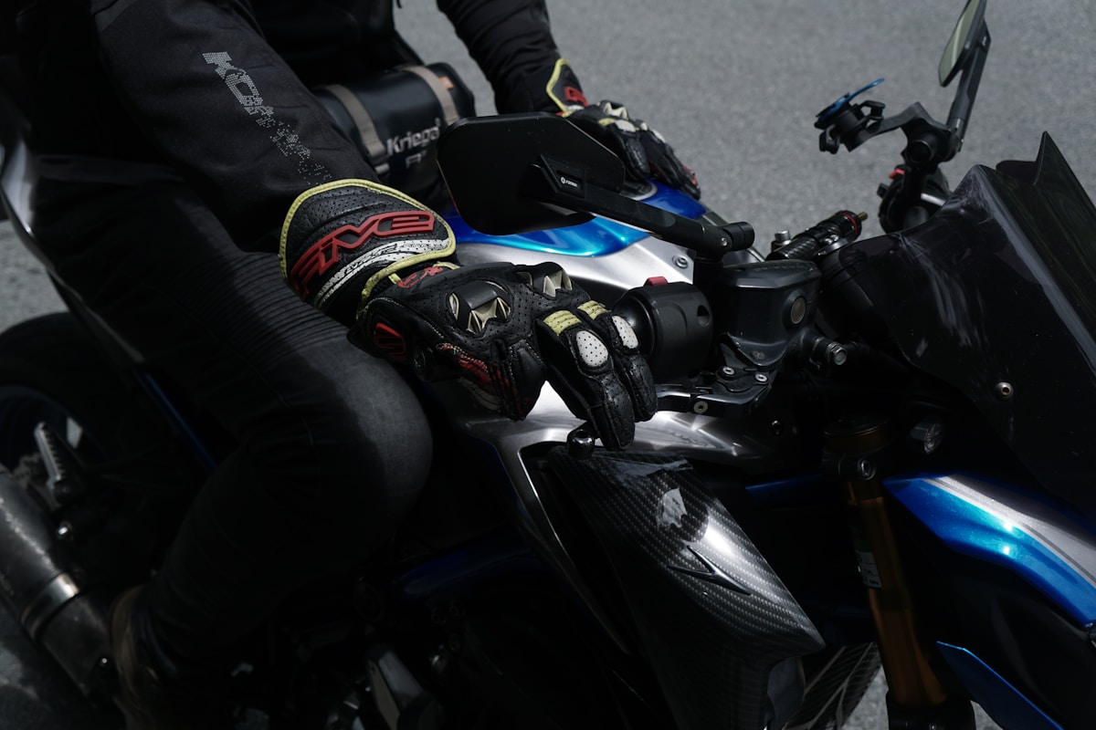 Rider wearing gloves on a motorcycle