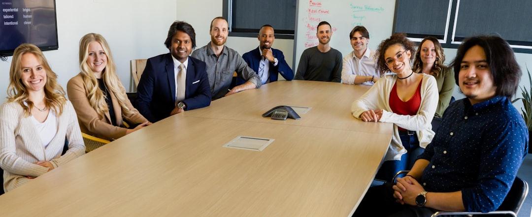 A team of diverse professionals collaborating around a table, symbolizing growth and strategy.