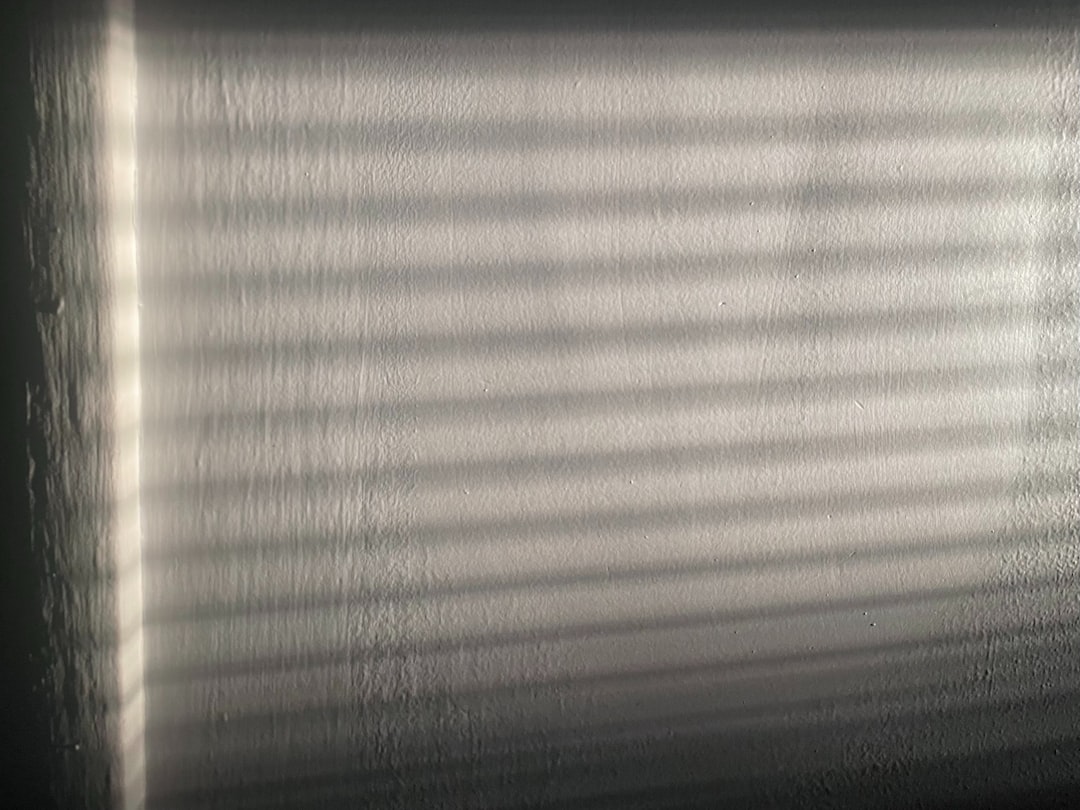 Someone at a desk in a dark room, looking totally frustrated with their computer—a perfect visual for hitting technical roadblocks.