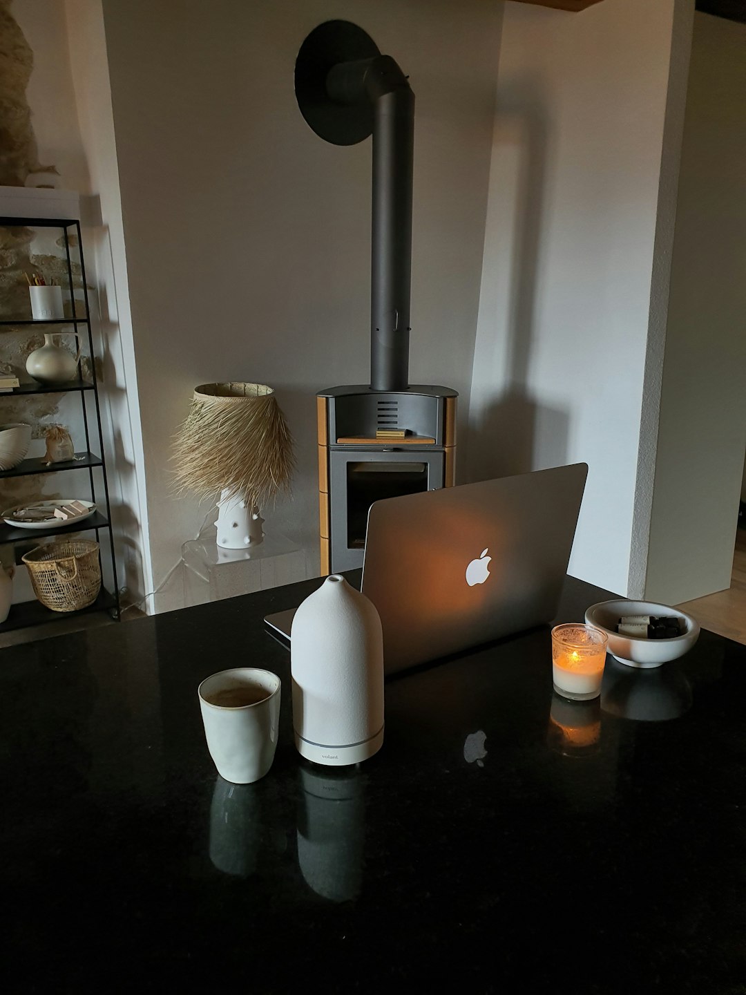 A clean, minimalist desk with a laptop, plant, and coffee, hinting at Kleap's simple, no-fuss approach to website building.
