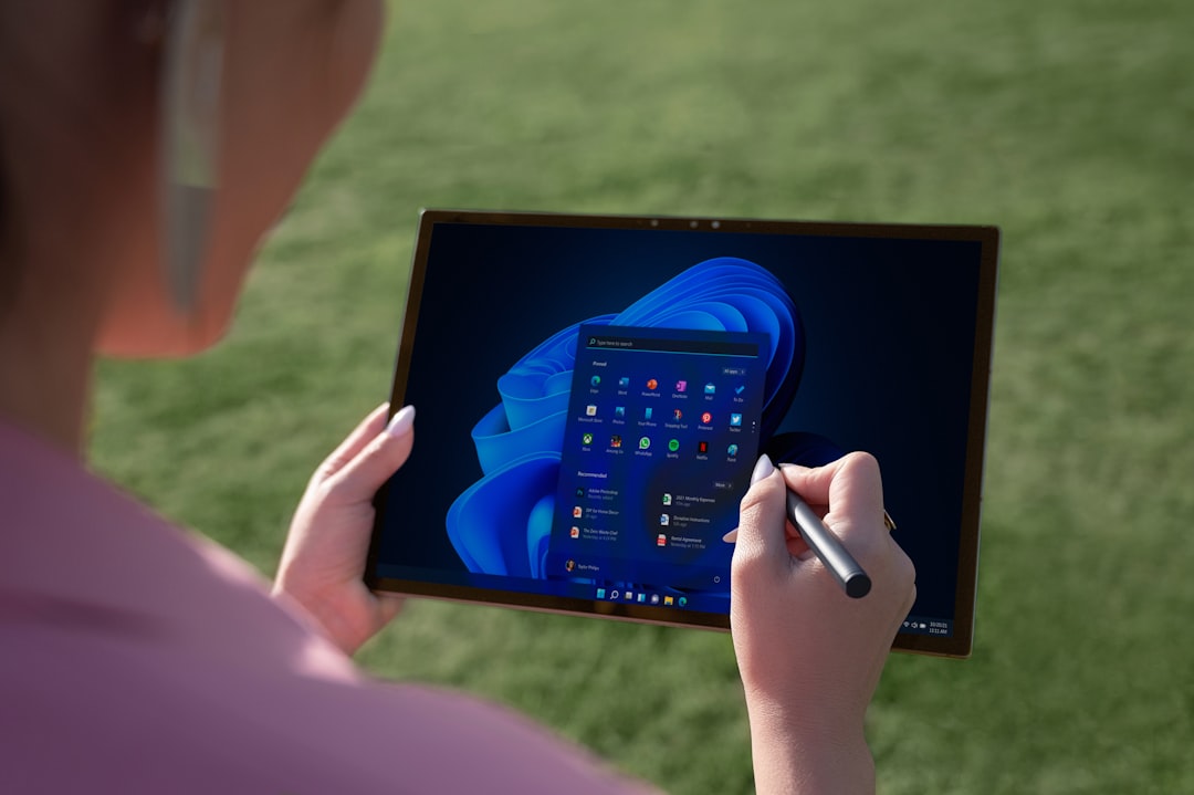 A marketer looking over an AI-generated content schedule on a big tablet, with charts and social media post mockups on the screen.
