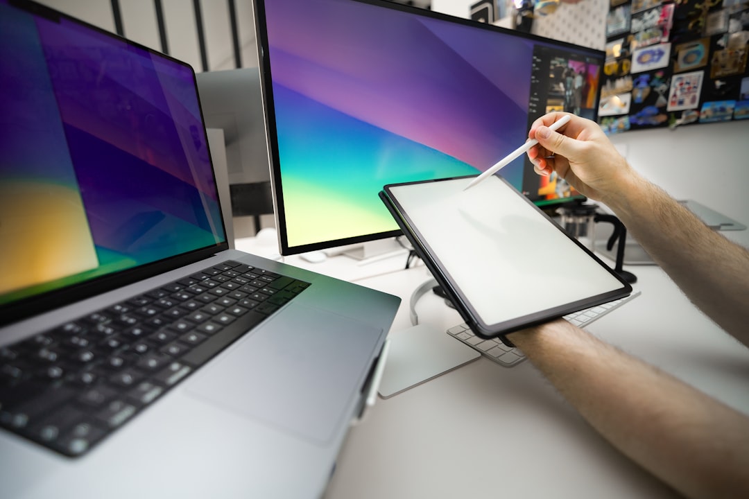 A close-up shot of someone's hands typing on a sleek, modern laptop. There's a cup of coffee sitting next to it, giving off a productive vibe.