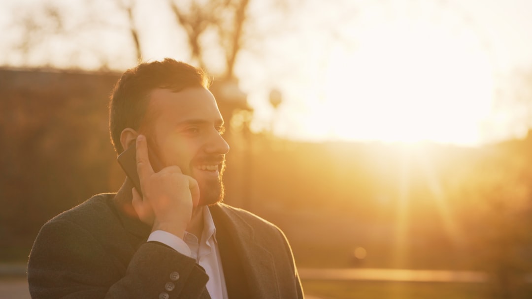 A stock photo of a customer support agent with a headset, smiling and ready to help.