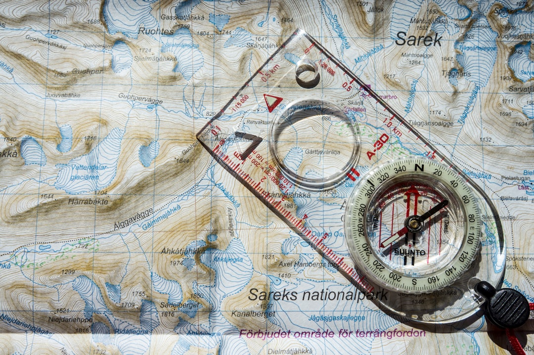 An old-school compass on a crinkled map, which perfectly captures the need for strategic direction and solid planning in SEO.