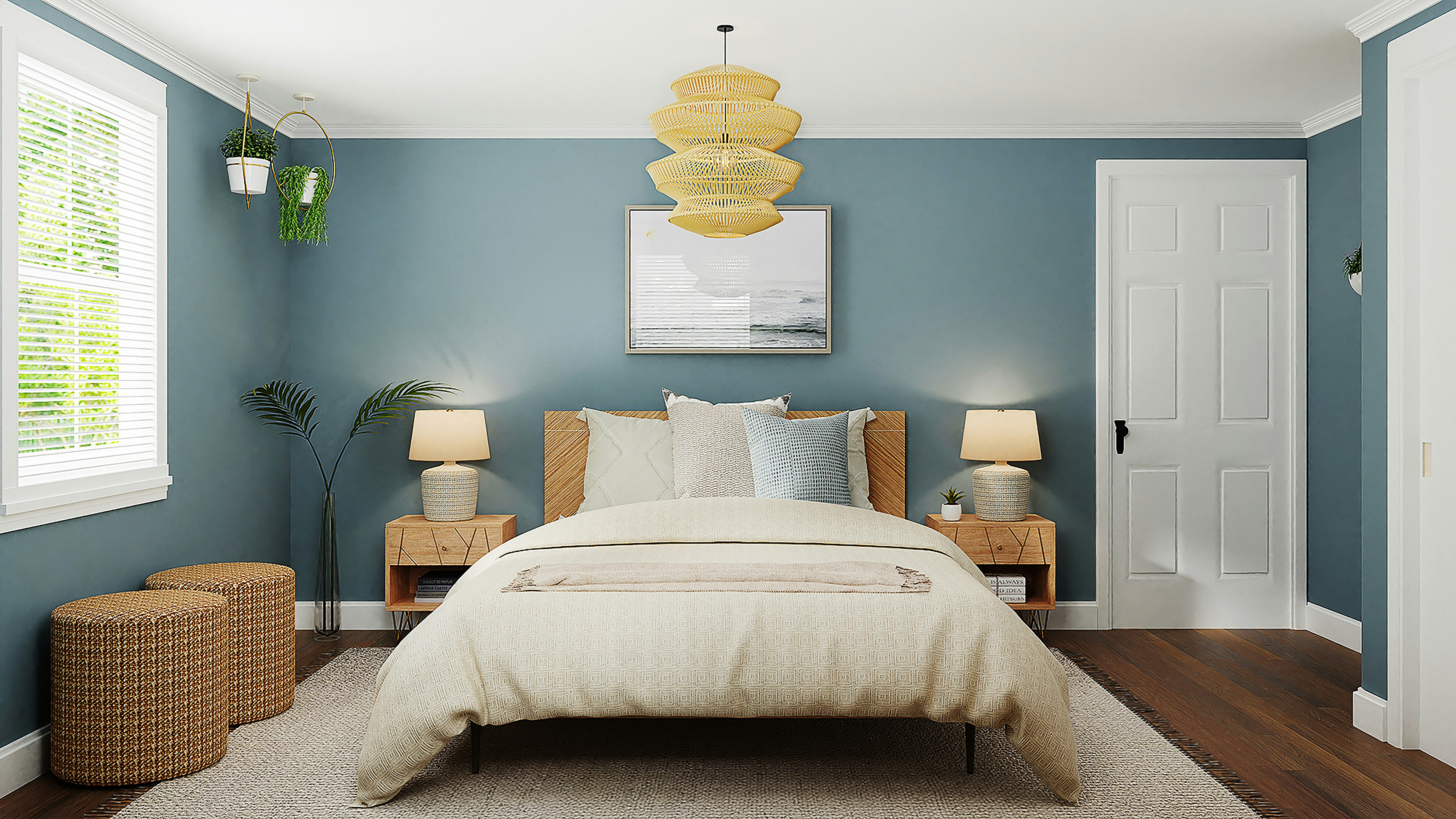 Une palette de couleurs harmonieuse dans une chambre avec un mur principal bleu canard, du linge de lit gris et des touches de jaune moutarde dans les coussins.