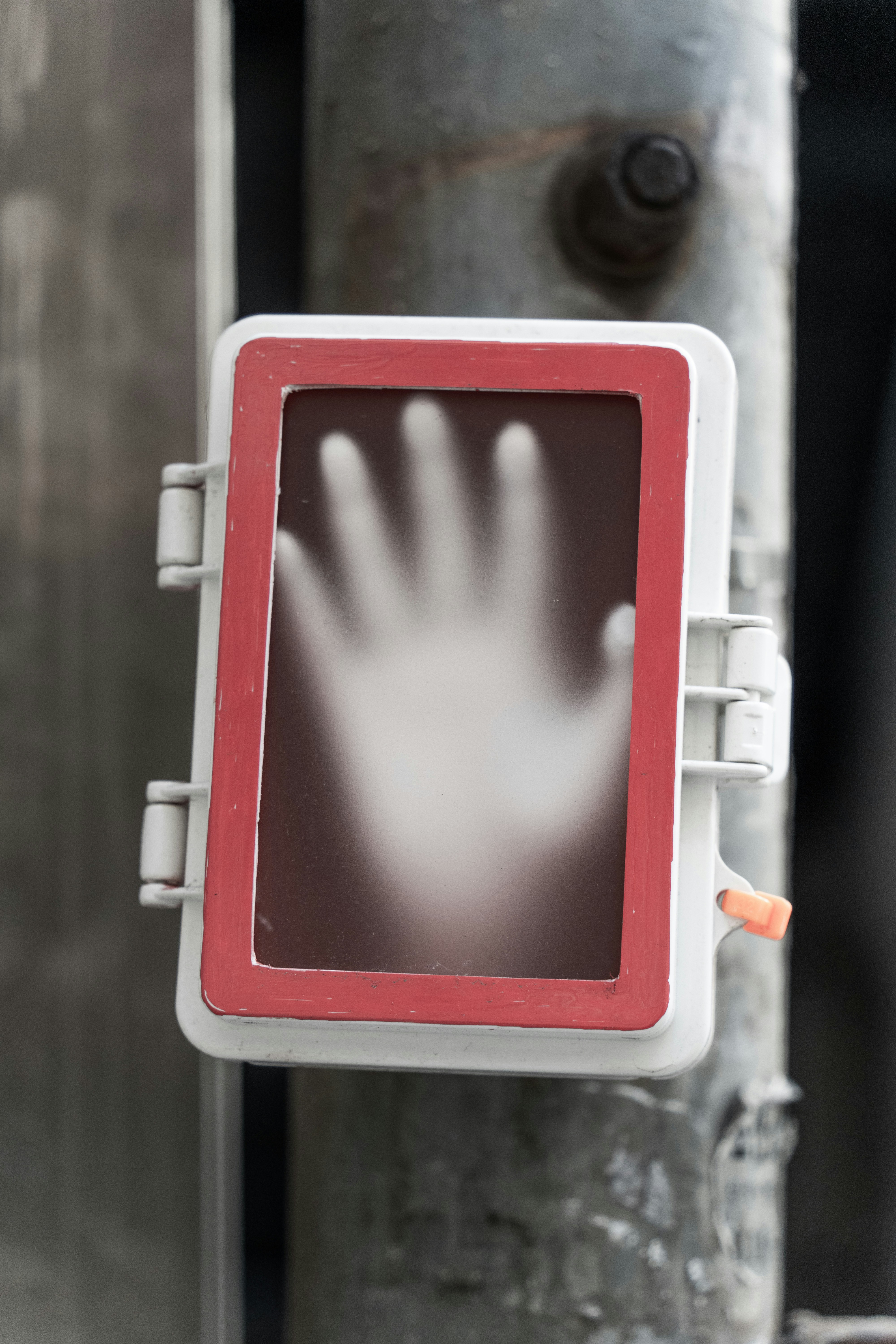 A close-up shot of a performer's hand holding a smartphone, displaying a simple tipping page on the screen with options for different amounts.