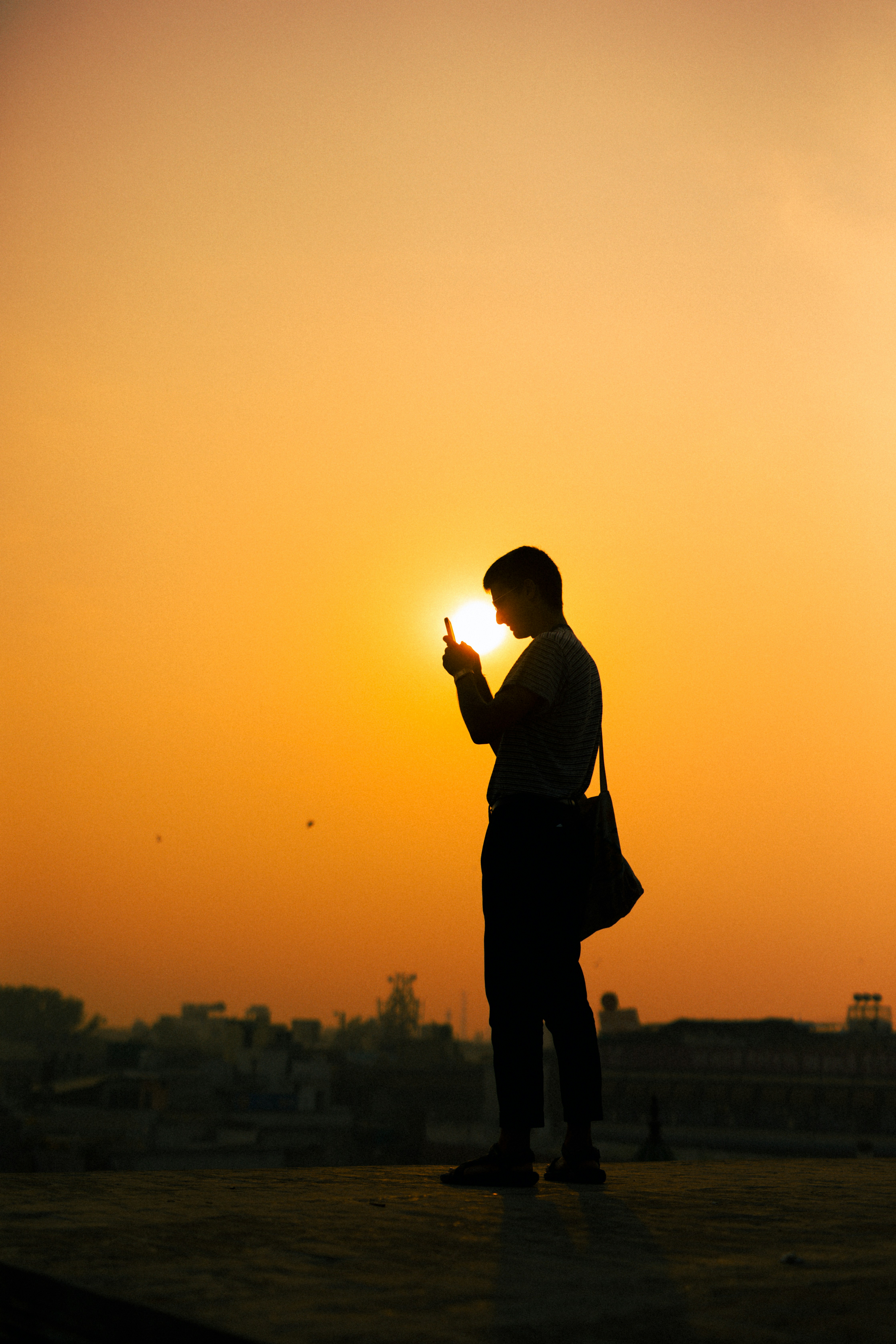 A close-up of a person’s finger tapping on a language selection option on a smartphone screen.