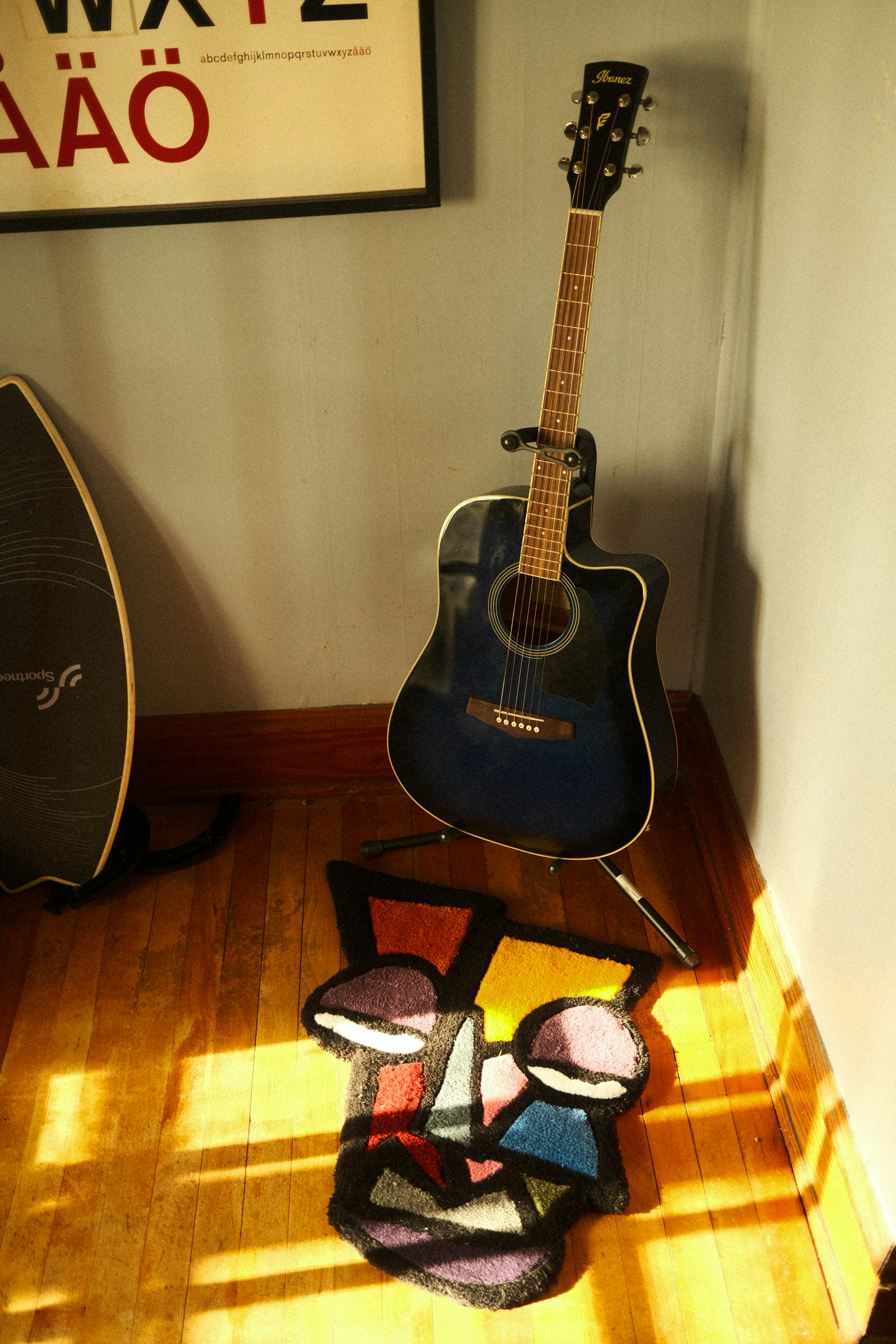 Relaxing atmosphere with a guitar and a notebook, symbolizing balance between hobbies and work