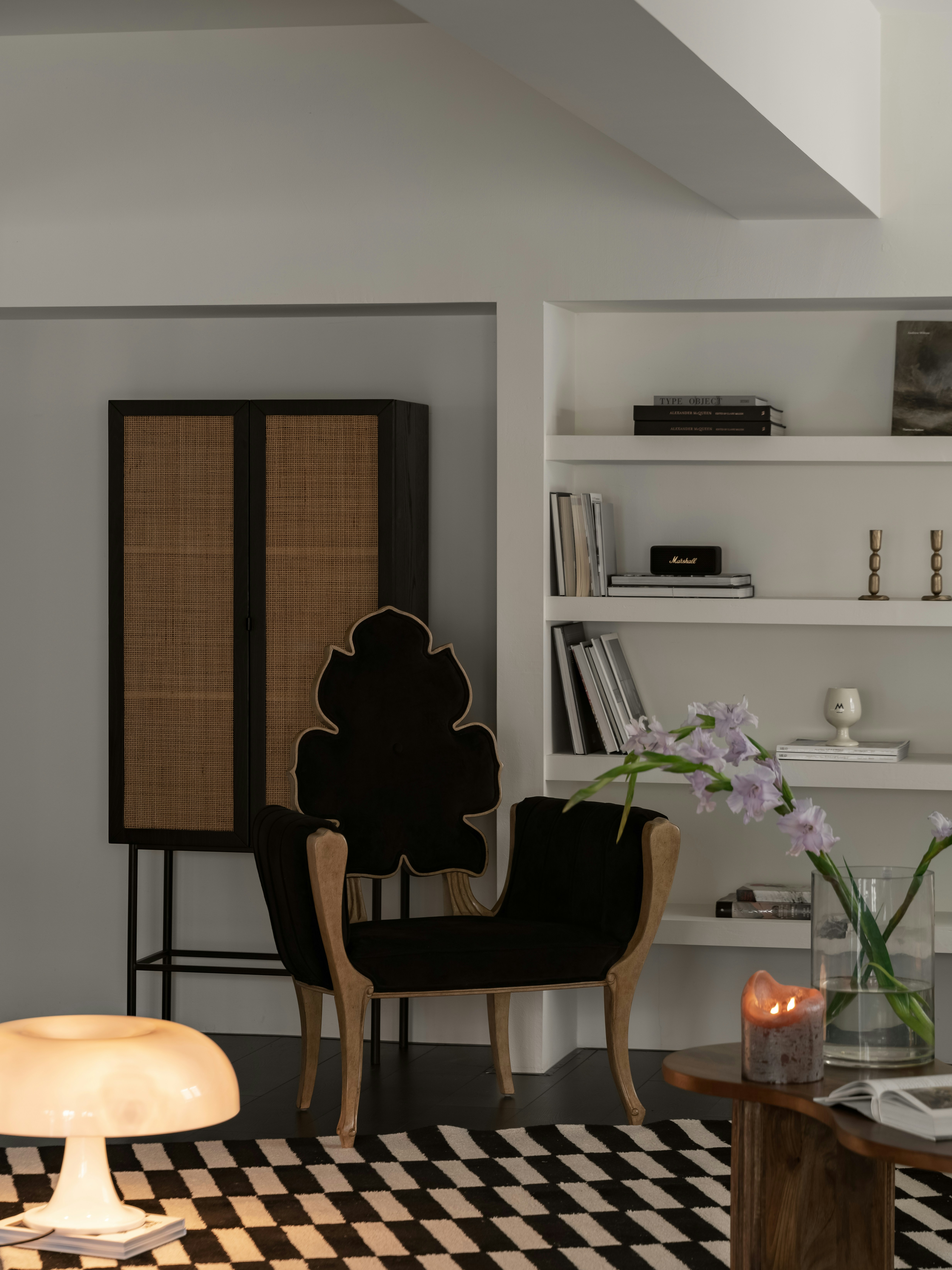 Architectural wide shot of a luxury minimalist living room with custom fitted dark wood cabinets and comfortable furniture