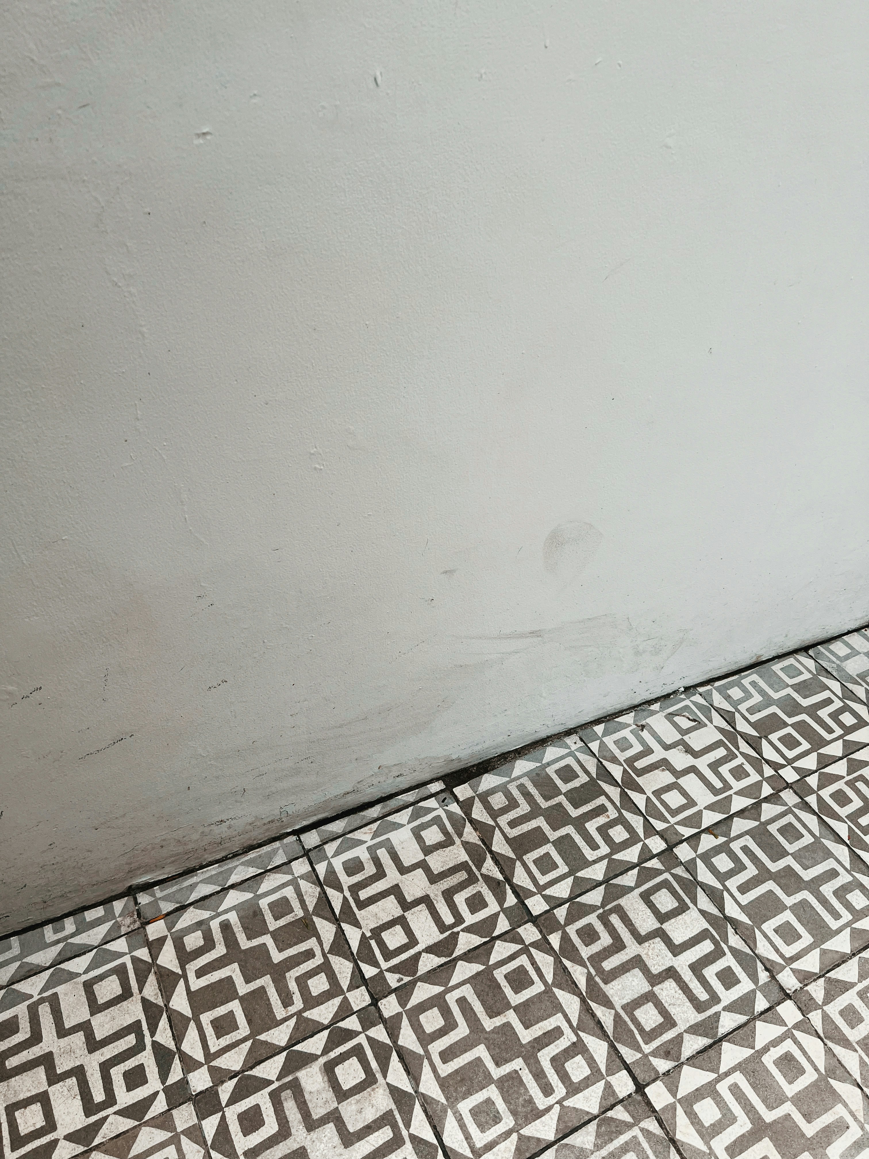 Modern bathroom with pristine tiling and fixtures, showcasing the quality of finish after repair