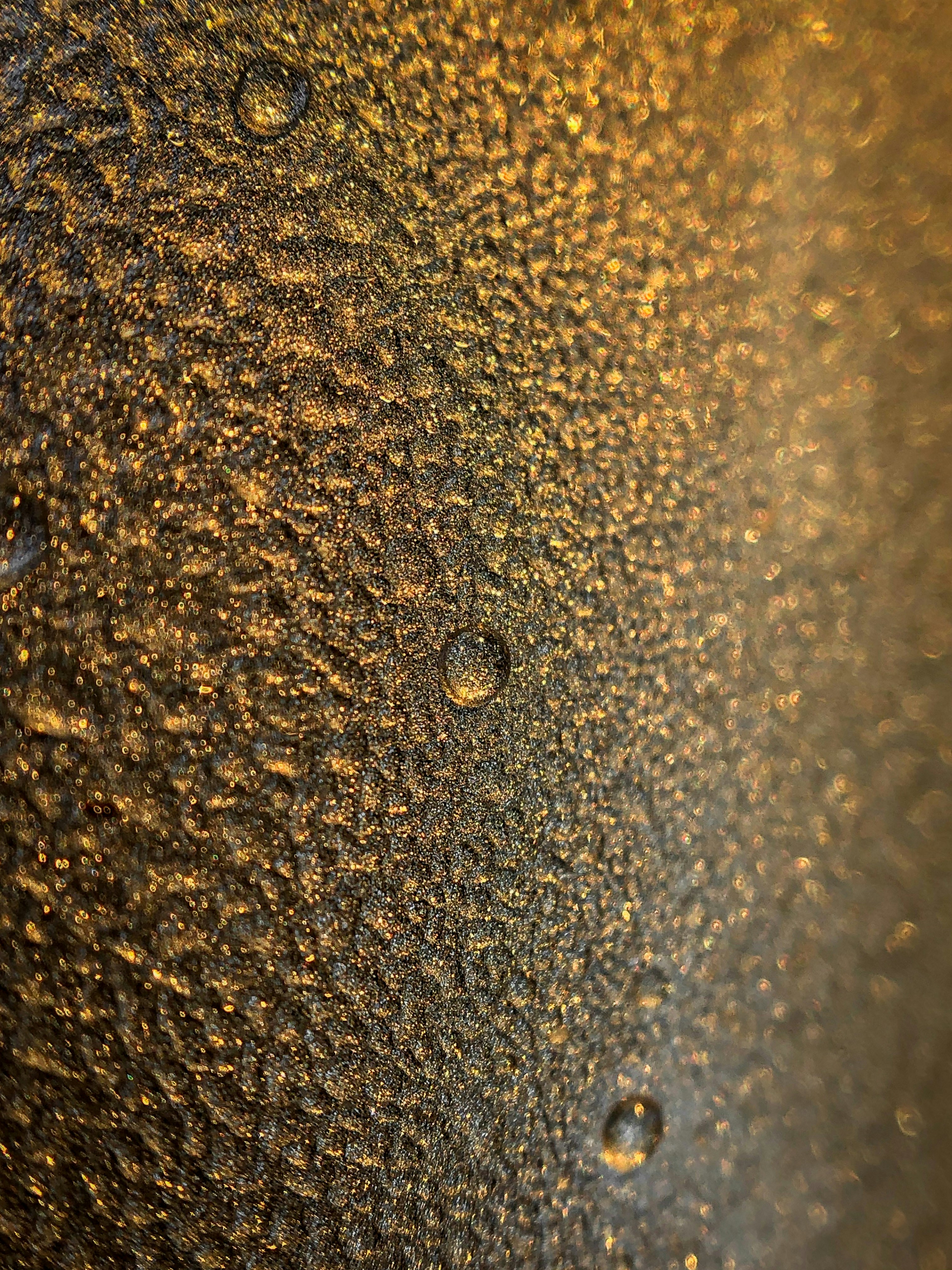 Close up of water droplets on a copper pipe showing corrosion