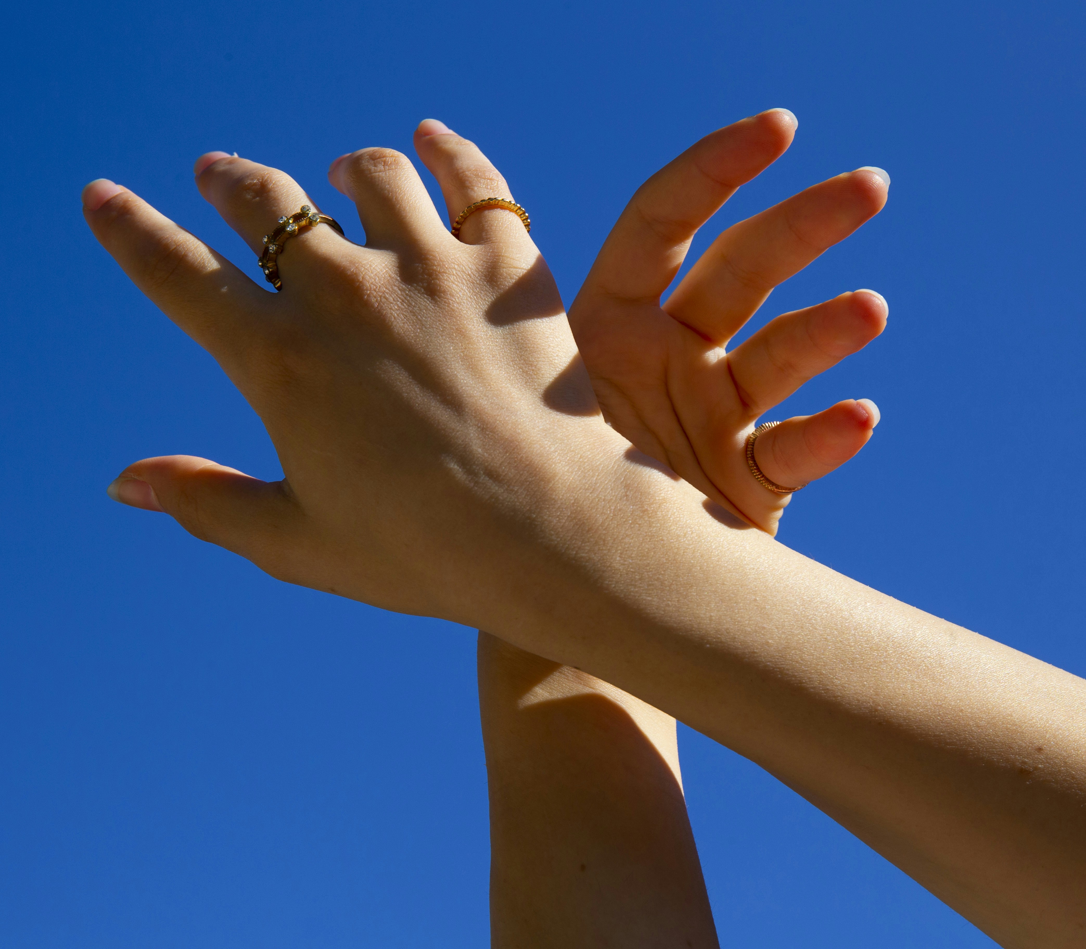 Close up of a therapist hands working on a patient back demonstrating manual therapy
