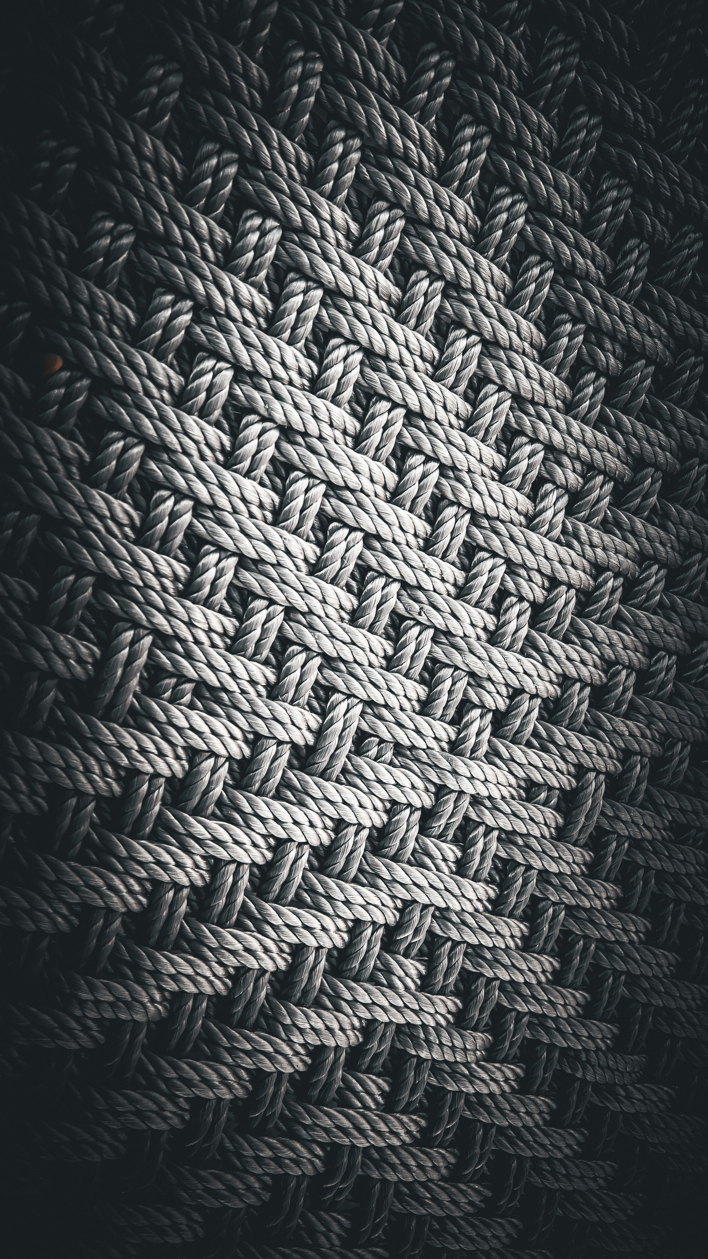 Close up shot of a fabric blind texture showing the weave pattern, clearly distinct from wood or metal
