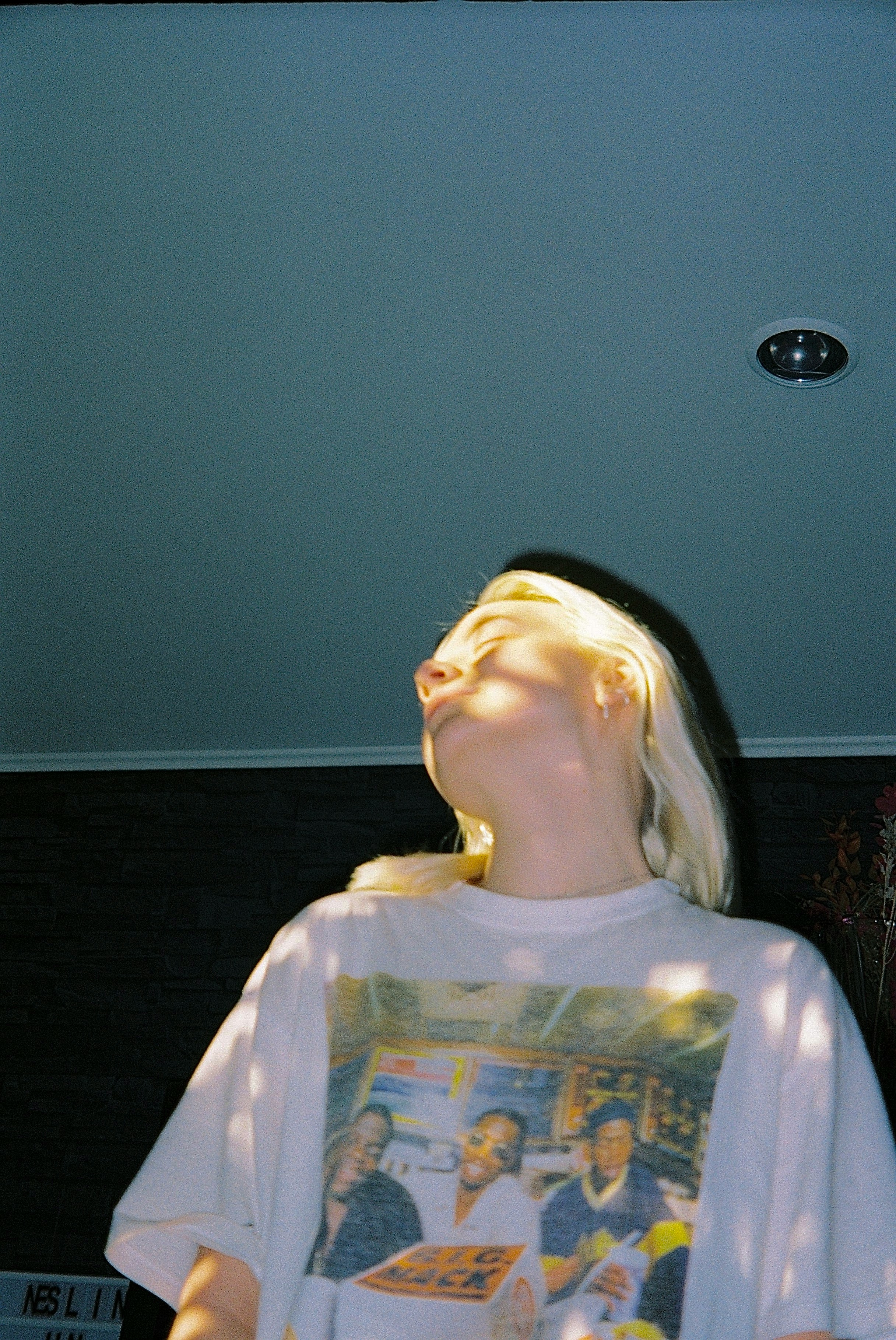 Close up of a therapist's hands gently holding a patient's head during a craniosacral session