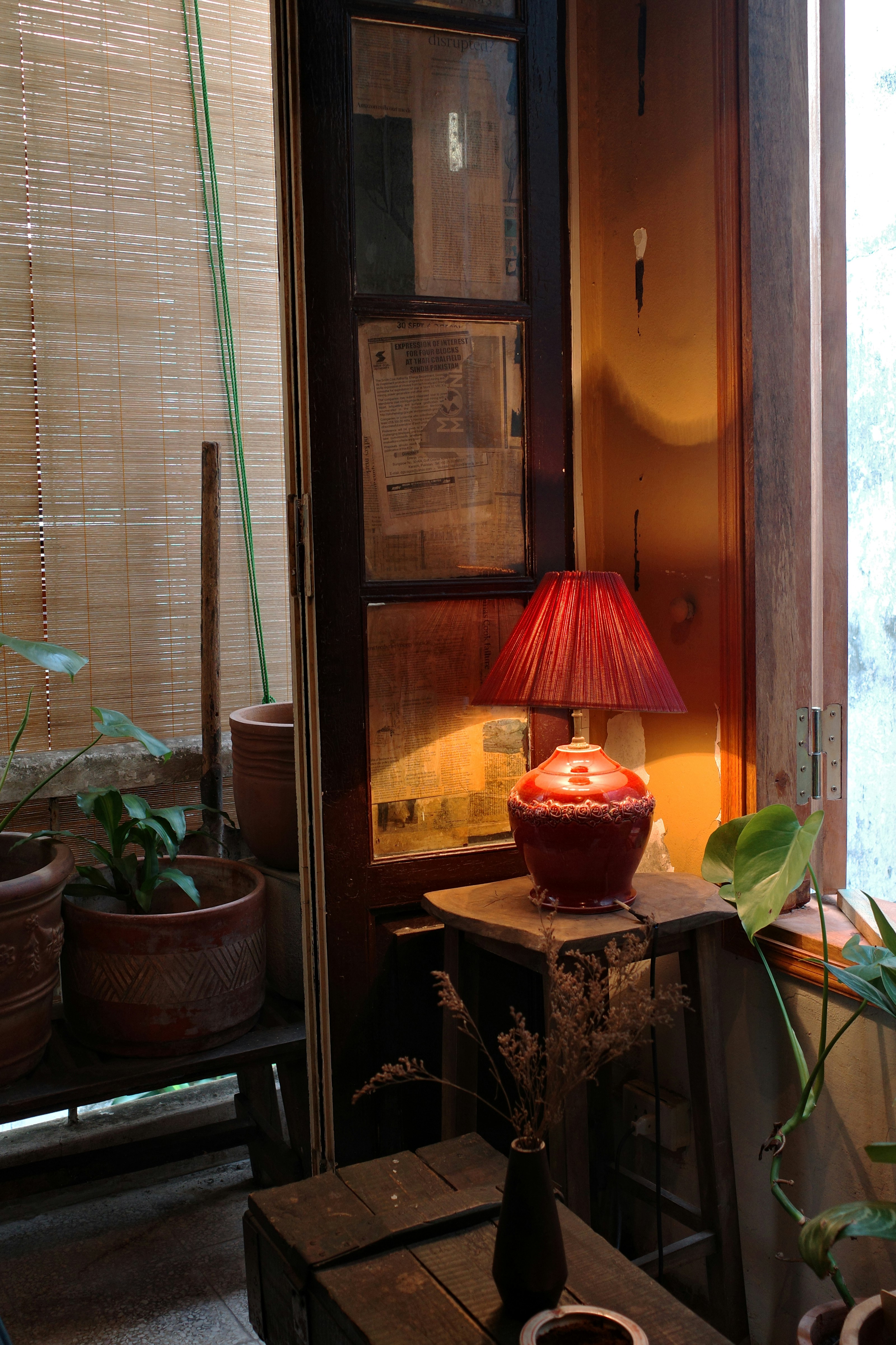 A serene living room filled with natural light and burning sage stick on a table, symbolizing energy cleansing and purification