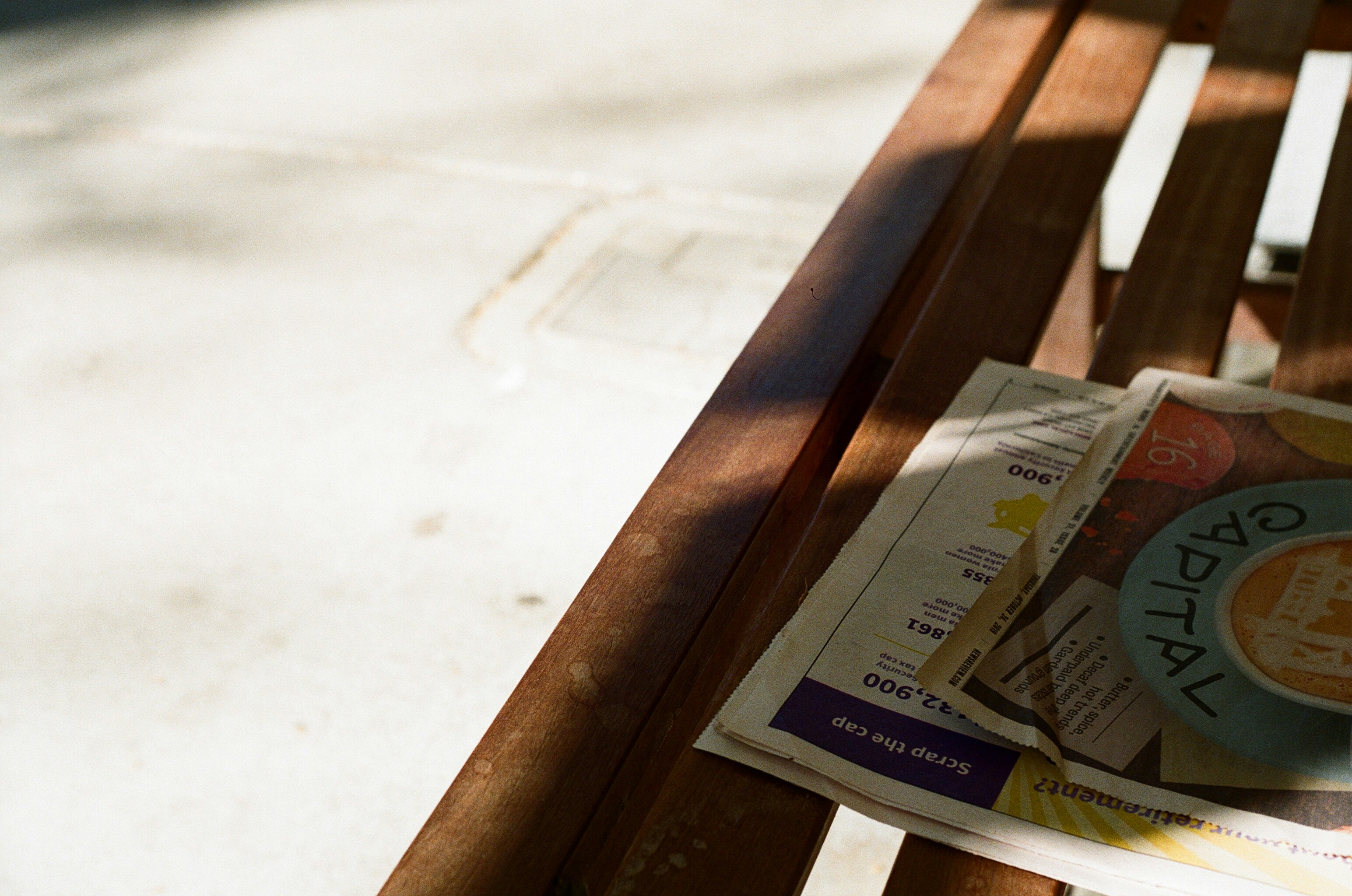 Close up of hands signing a contract with a calculator and swiss francs nearby